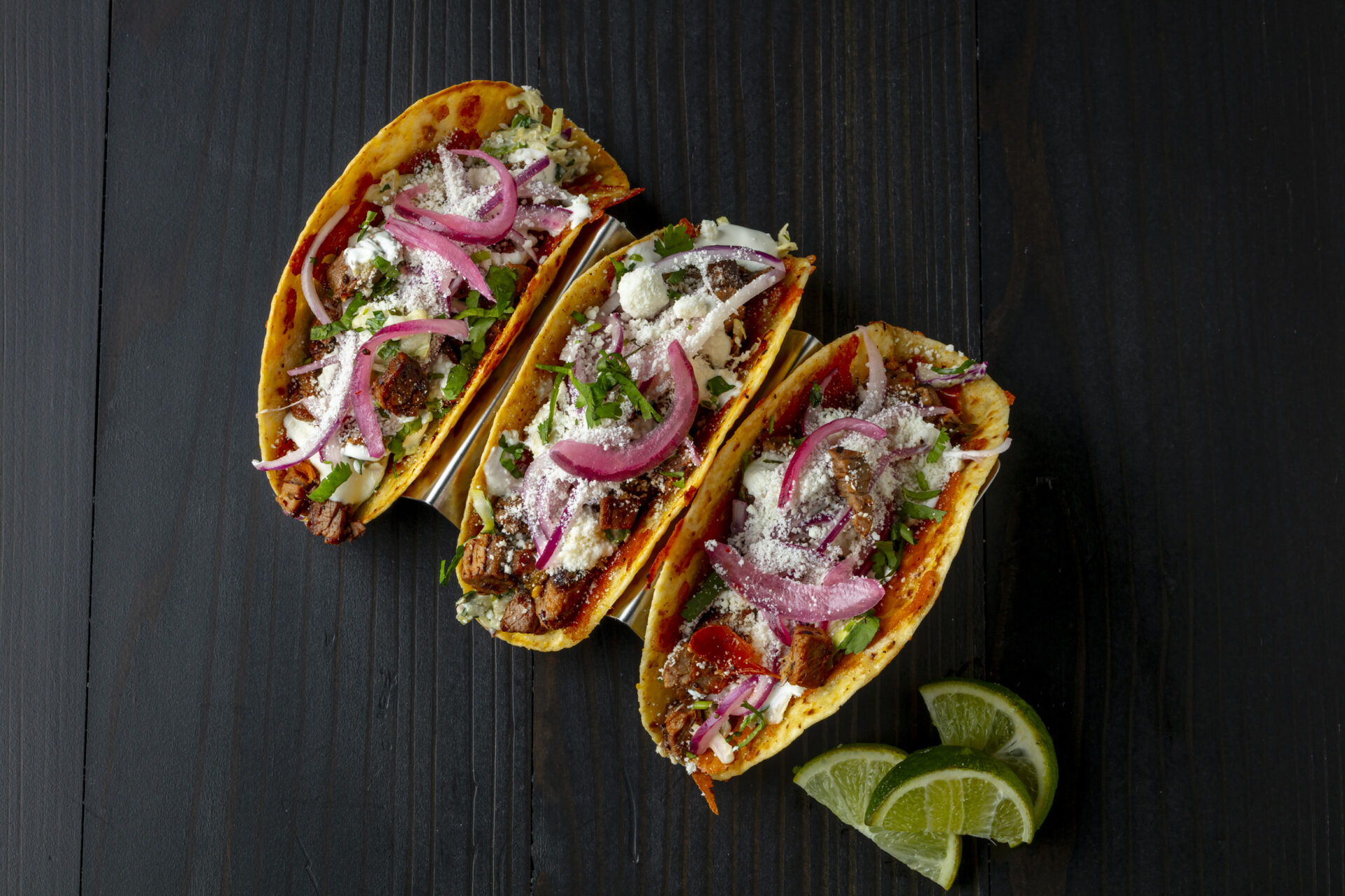 Brisket tacos plated for a client menu